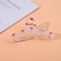 Detail of transparent strawberry print hair claw clip with golden metal spring - Strawberry / Large