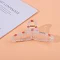 Detail of transparent large hair claw clip with red floral print and metal spring - Flower / Large
