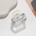 Detail of a clear acrylic square hair claw clip with a sleek gold metal spring mechanism - Transparent Style (A)