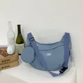 Morandi blue crescent crossbody bag with wide strap and matching round coin purse - Blue