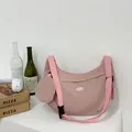 Pink crescent nylon crossbody bag with wide strap and matching round coin purse detail - Pink
