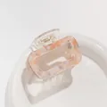 Detail of square acetate hair claw clip with pink and purple marble texture on a white plate - Pink Orange Marble (B)