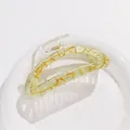 Close-up of pale green resin hair claw with golden marble pattern and transparent handle - Light Green Gold Marble (E)