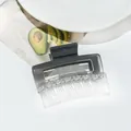 Close-up of square gradient acrylic hair claw clip with model S-033 engraving - Gray