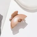 Close-up of matte beige hair claw clip with metal spring on a clean white surface - Dark Khaki