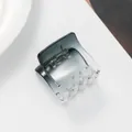 Close-up of a mini transparent gradient hair claw clip with a durable metal spring - Gradient Gray Black (Black) / Black