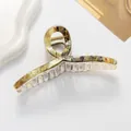 Macro view of 13cm marble patterned hair claw with elegant Chinese calligraphy design - Yellow