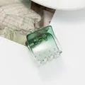 Detail showing the green gradient translucent resin hair claw with a durable metal spring - Green