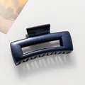 Close-up of a large square hair claw clip with a shimmering blue gradient and glitter finish - Deep Blue