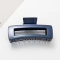 Detailed view of the sparkling dark blue starry finish on a 12cm hollow hair claw clip - Dark Blue