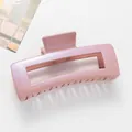 Macro detail of large 12cm hollow pink glitter claw clip with pearlescent finish - Pink