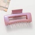 Detailed view of a large square pink-purple hair claw clip with a shimmering finish - Pink