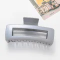 Macro detail of a 12cm large square shark hair claw clip in shimmering grey-blue finish - Gray