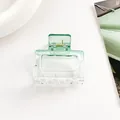 Detail view of small square resin hair claw clip in transparent green gradient finish - Green