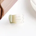 Detailed view of a gradient light green hair claw clip with a semi-transparent resin finish - Light Green