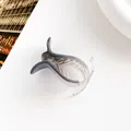Detail of blue and clear acrylic hair claw clip with elegant curved design - Gray