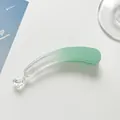 Macro detail of gradient mint green banana clip with anti-slip teeth and resin finish - Sky Blue