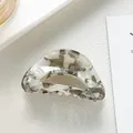 Close-up of marble pattern acetate hair claw clip for kids with smooth glossy finish - Gray
