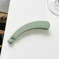 Detailed close-up of matte green banana hair clip with secure anti-slip locking mechanism - Green