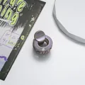 Detail of mini round glitter claw clip with purple iridescent finish for hair styling - Khaki