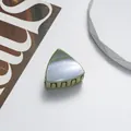 Detailed top view of a green glitter cat ear hair claw with iridescent purple finish - Green