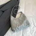 Silver metallic pleated crescent bag with butterfly charms and adjustable strap - Silver