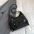 Black casual shoulder bag with silver butterfly charms and soft crinkled texture - Black