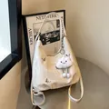 White pleated hobo shoulder bag with silver butterfly accents and plush cloud charm - With Pendant / White