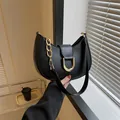 Chic black hobo bag with golden D-buckle and chain, stylish minimalist shoulder handbag - Black