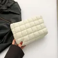 Chic quilted white puffer handbag featuring a minimalist cloud-stitched design - White