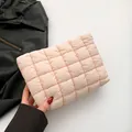 Chic light pink quilted cloud clutch bag with large puffy squares and soft nylon texture - Pink