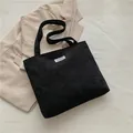 Sac fourre-tout noir en velours côtelé pour femme avec étiquette Fashion Instinct - Noir
