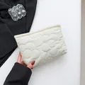 Chic white bucket clutch bag featuring floral quilted pattern and textured soft material - White