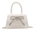 Mini white crossbody bag for women with trapezoid shape and silver rhinestone bow - White