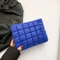 Quilted blue nylon clutch with cloud-like embroidery and chic pleated design - Blue