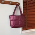 Glossy quilted burgundy tote bag with padded texture and long shoulder straps - Red