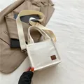Mini off-white corduroy crossbody bag with adjustable wide strap and leather label - White