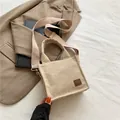 Beige corduroy mini crossbody bag with wide shoulder strap and vintage leather patch - Beige