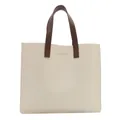 Chic beige tote bag with brown handles and gold lettering for daily office commute - White