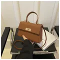 Brown woven texture crossbody handbag with gold metal lock and top handle for women - Brown