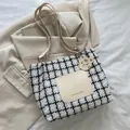 Black and white houndstooth tote bag with beige leather pocket and tiger charm - White