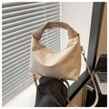 Beige crescent handbag with ruched handle and adjustable crossbody strap in soft light - Off White