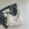 White faux leather tote bag with silver butterfly accents and cloud charm - With Pendant / White