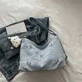 Light blue pleated tote bag with silver butterflies and a white plush cloud charm - With Pendant / Blue