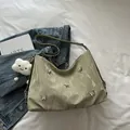 Light green pleated underarm bag with silver butterfly charms and cloud pendant - Green