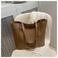 Brown leather large capacity tote bag with contrast white stitching and double shoulder straps - Brown
