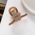 Macro view of 7cm floral hair claw clip in beige resin with Barrette La France text - 3D Striped Flower Decor / Khaki