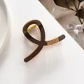 Detailed view of deep brown hair claw clip with rose gold frame and inlaid rhinestones - Coffee