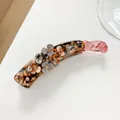 Detailansicht der Bananen-Haarklammer mit 3D-Resinblumen und glitzernden Strasssteinen - Dunkelbraun