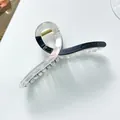 Detail of extra large hair claw clip with colorful resin and golden metal spring - Black